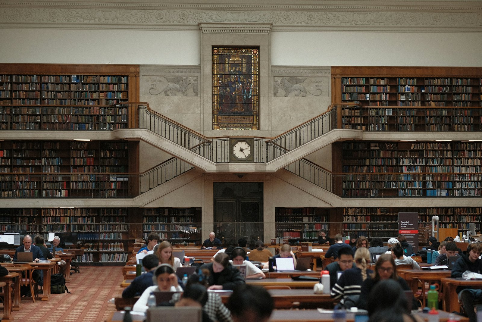 A large library reading room lined with bookshelves.